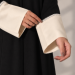 Black Super Nida Half-Kloosh Abaya with Beige Trim from Jelena Abaya.