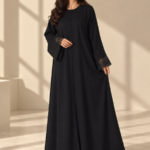 Front view of black Super Nida half-kloosh abaya 1073 with black appliqué.