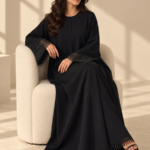 Front view of black Super Nida half-kloosh abaya 1073 with black appliqué.