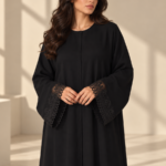 Front view of black Super Nida half-kloosh abaya 1073 with black appliqué.