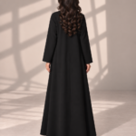 Model wearing open black Kubra quarter-kloosh abaya 1074 with glossy diagonal front detail.