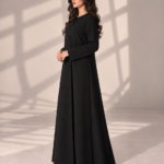 Model wearing open black Kubra quarter-kloosh abaya 1074 with glossy diagonal front detail.